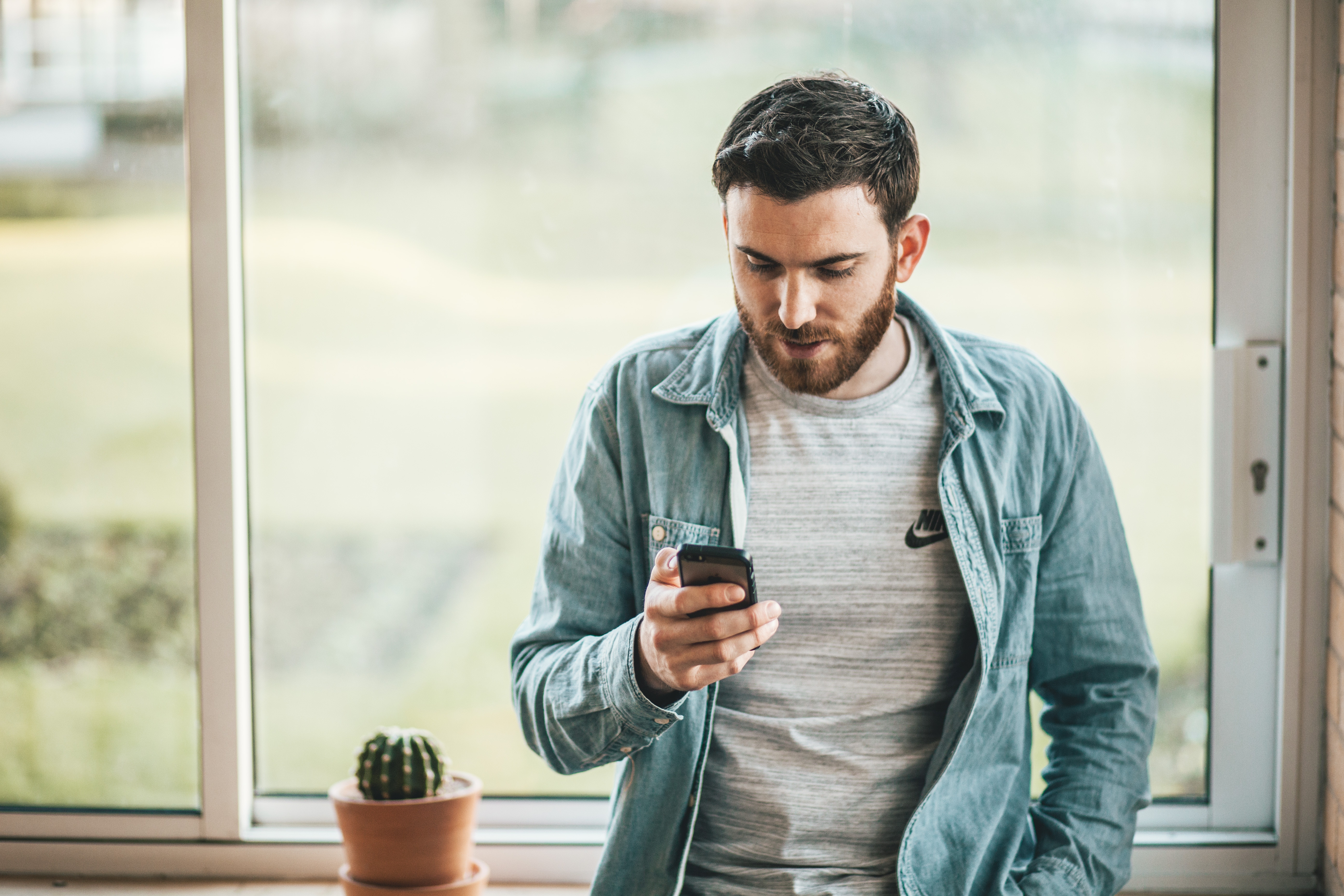 Man stressed looking at phone