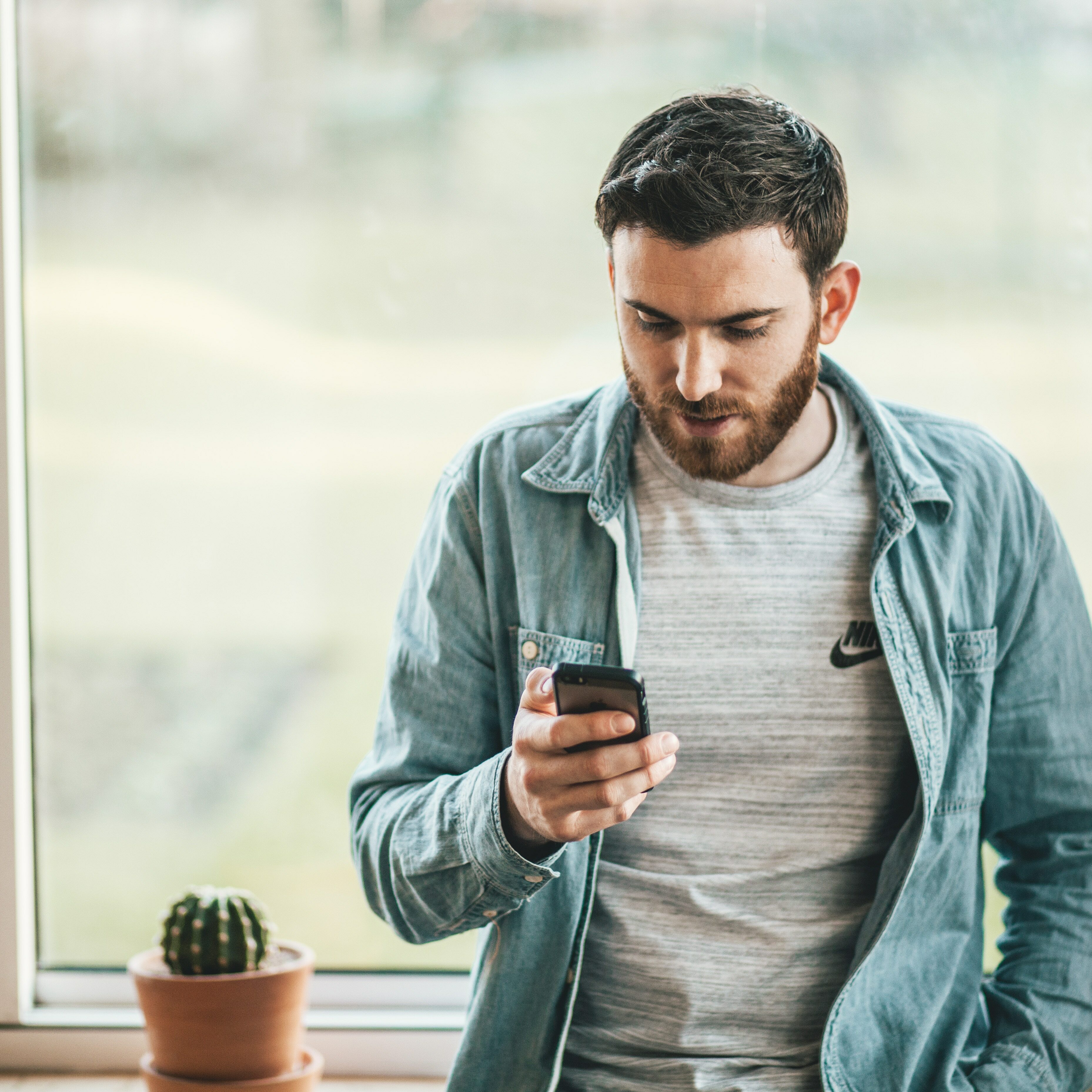 Man stressed looking at phone